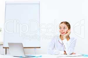 Young woman generating ideas in office