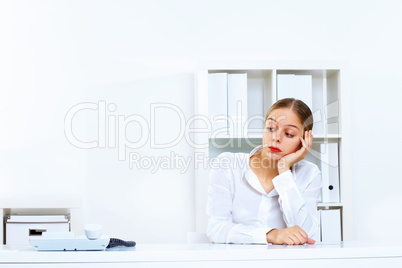 Young woman with a phone in office