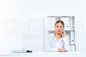 Young woman with a phone in office