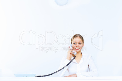 Young woman with a phone in office