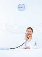 Young woman with a phone in office