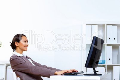 Young woman in business wear working in office