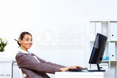 Young woman in business wear working in office