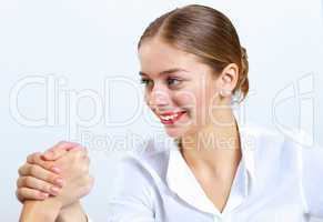 Young women arm wrestling in office