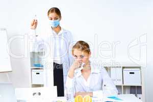 Nurse with syringe doing vaccination in office