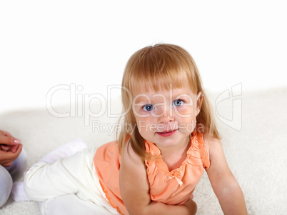 Little blond girl in studio