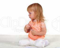 Little blond girl in studio