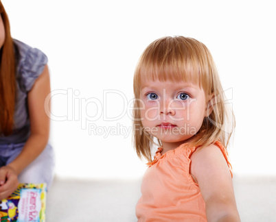 Little blond girl in studio