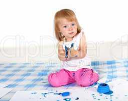 Little girl painting in studio