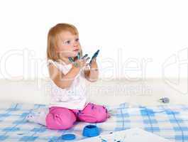 Little girl painting in studio