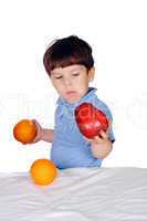 Young boy eats fruits