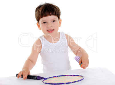 little boy with a racket