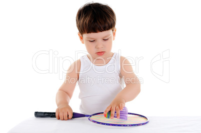 little boy with a racket