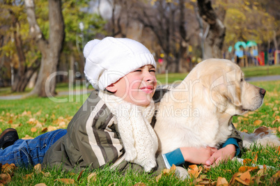 Boy playing in autumn park