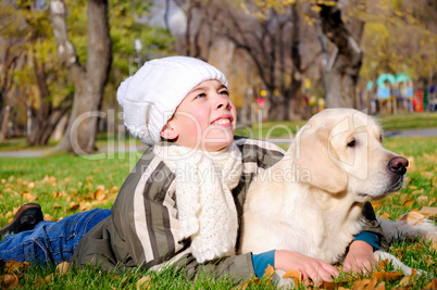 Boy playing in autumn park