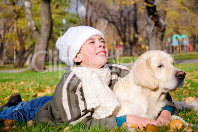 Boy playing in autumn park