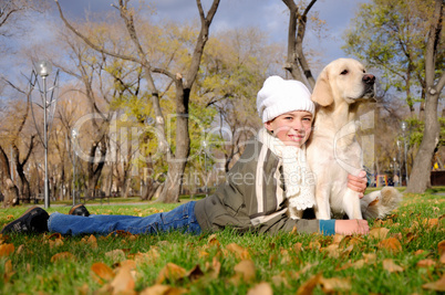 Boy playing in autumn park