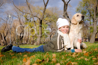 Boy playing in autumn park