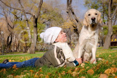 Boy playing in autumn park