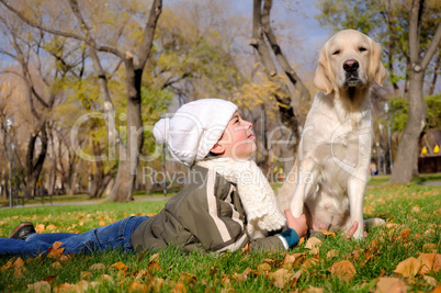 Boy playing in autumn park