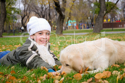 Boy playing in autumn park
