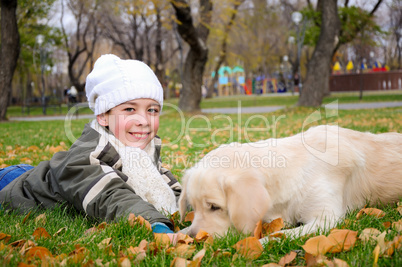 Boy playing in autumn park