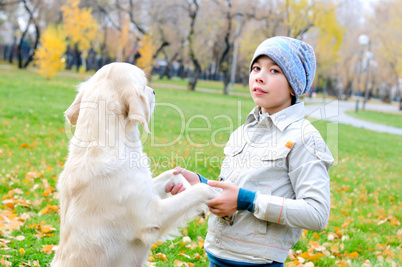 Boy playing in autumn park