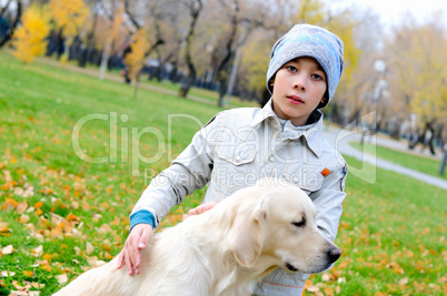 Boy playing in autumn park