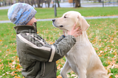 Boy playing in autumn park