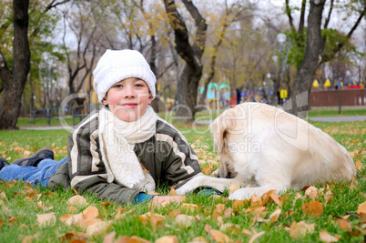 Boy playing in autumn park