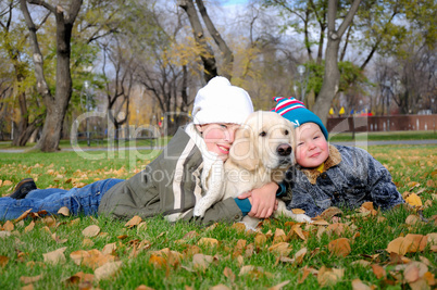 Boy playing in autumn park