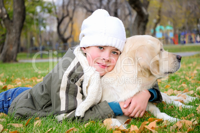 Boy playing in autumn park