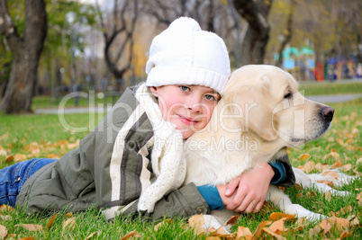 Boy playing in autumn park