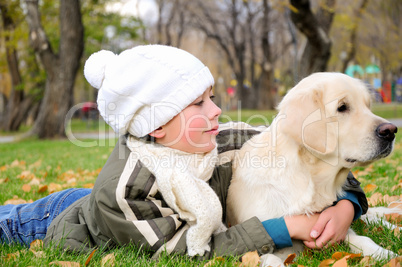 Boy playing in autumn park