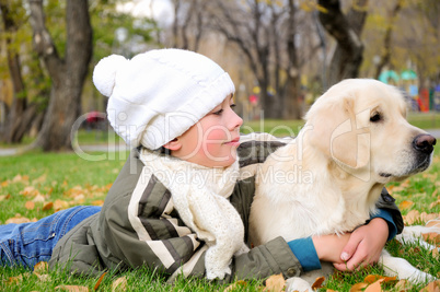 Boy playing in autumn park