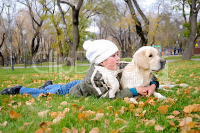 Boy playing in autumn park