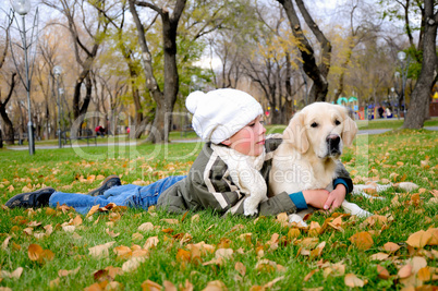 Boy playing in autumn park