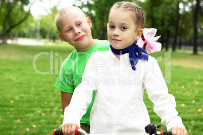 Girl on a bicycle in the green park