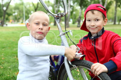 Boy on a bicycle in the green park