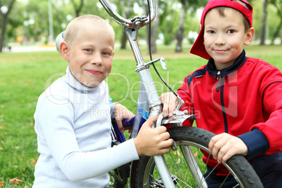 Boy on a bicycle in the green park