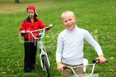 Boy on a bicycle in the green park