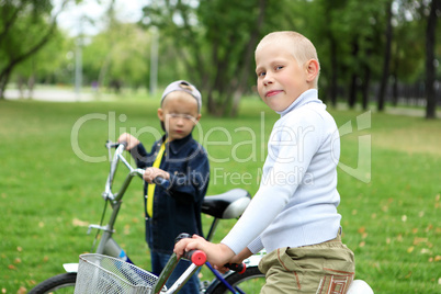 Boy on a bicycle in the green park