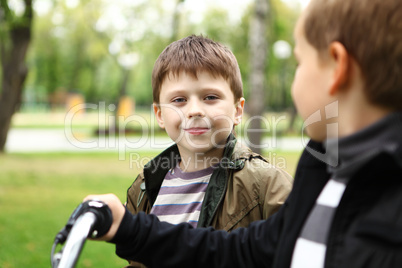 Boy on a bicycle in the green park