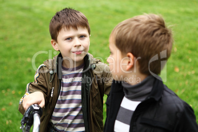 Boy on a bicycle in the green park