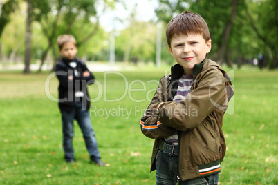 Boy with a friend in the green park