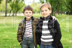 Boy with a friend in the green park