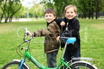 Boy on a bicycle in the green park