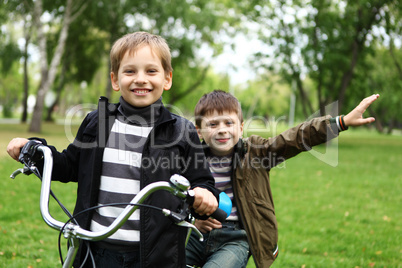 Boy on a bicycle in the green park