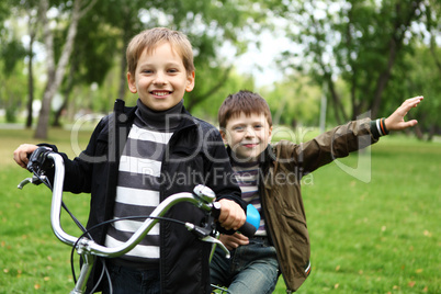 Boy on a bicycle in the green park