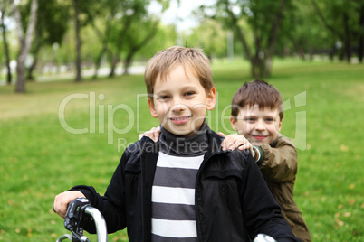 Boy on a bicycle in the green park